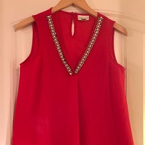 Adorned sleeveless red top